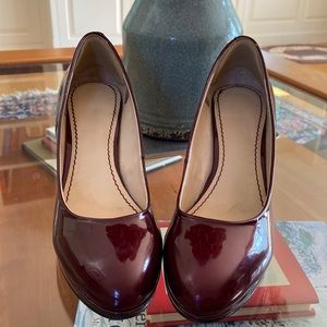 Burgundy patten leather heals.